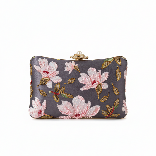 Floral-patterned clutch bag on a white background